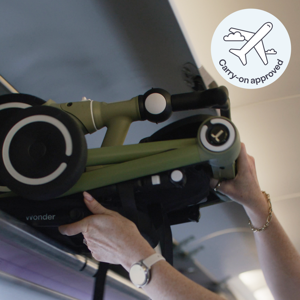 A folded Wonder being placed in an aircraft overhead locker
