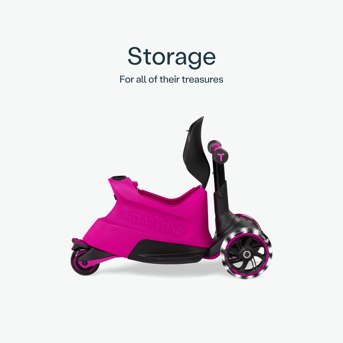 Pink smarTrike Xtend Ride-on scooter with storage compartment, designed for young children to ride and play comfortably.