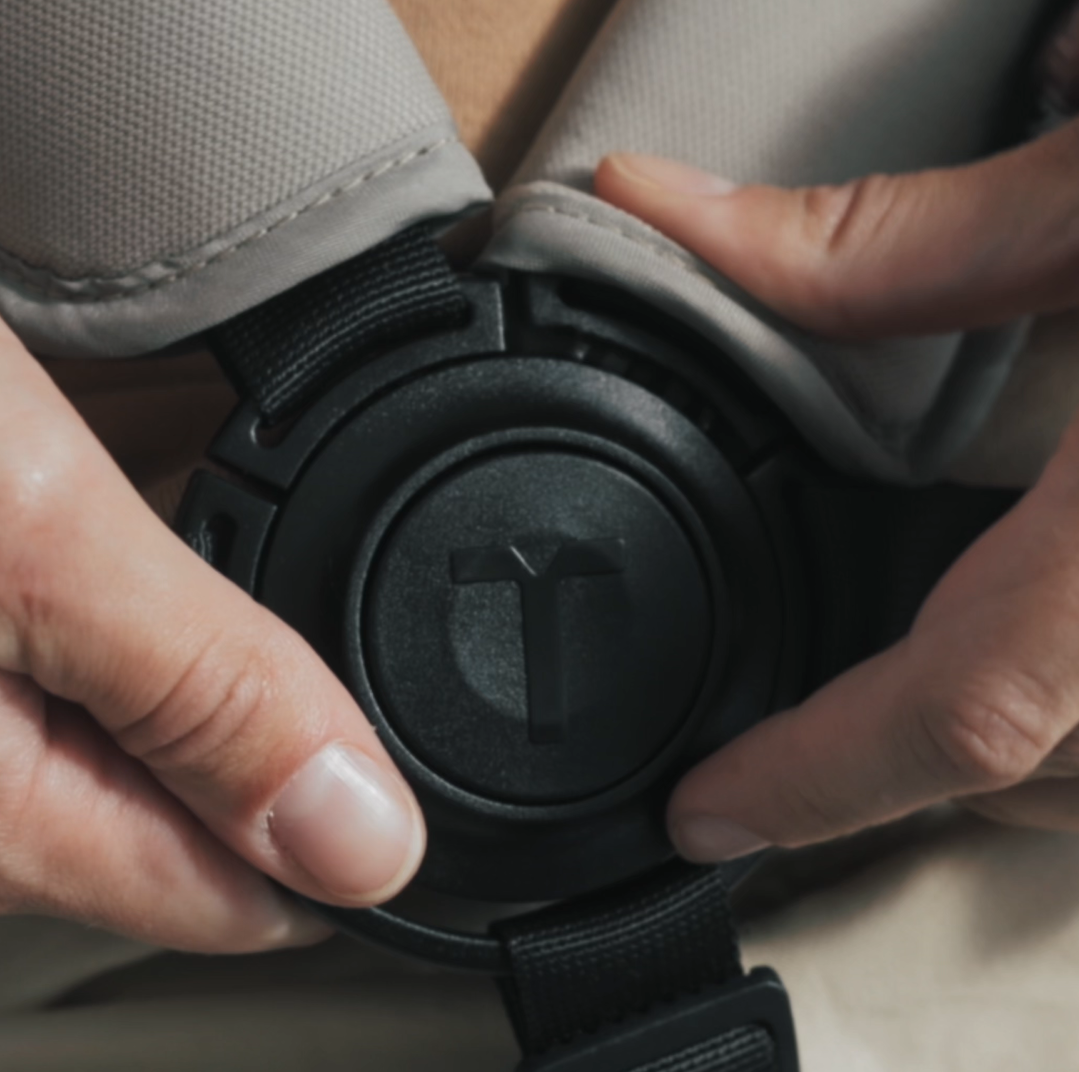 A close-up of a hand releasing the Wonder fold lock