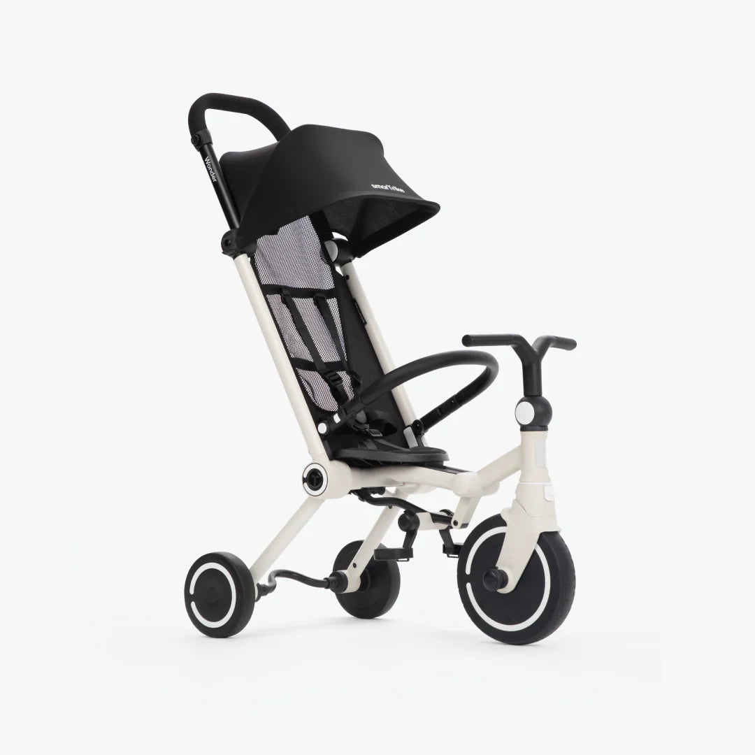 smarTrike Wonder stroller trike in Moonlight, white frame with a black canopy